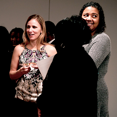 A group of employees meeting at an event