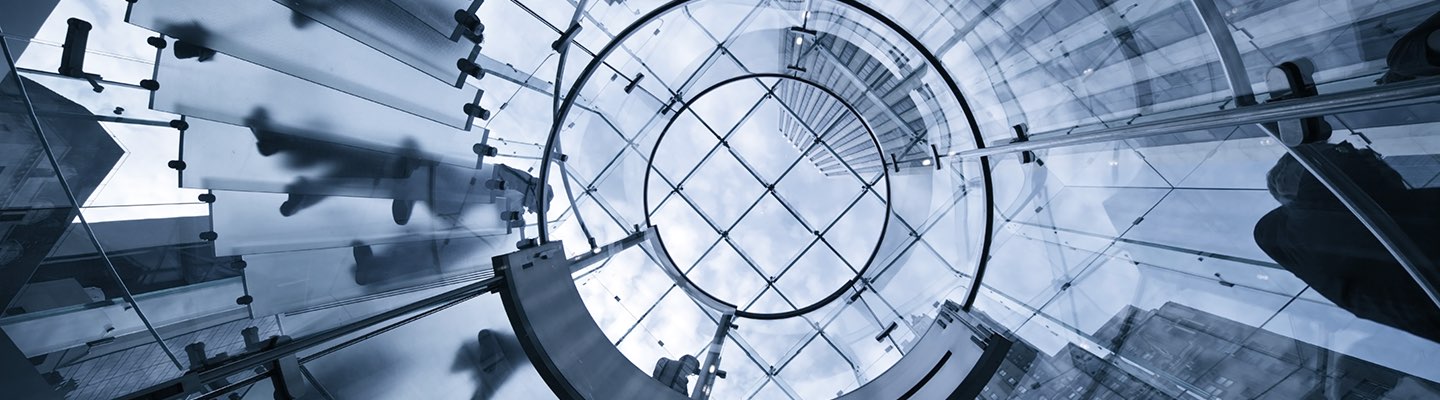 Image of glass, staircases, and building architecture, looking up